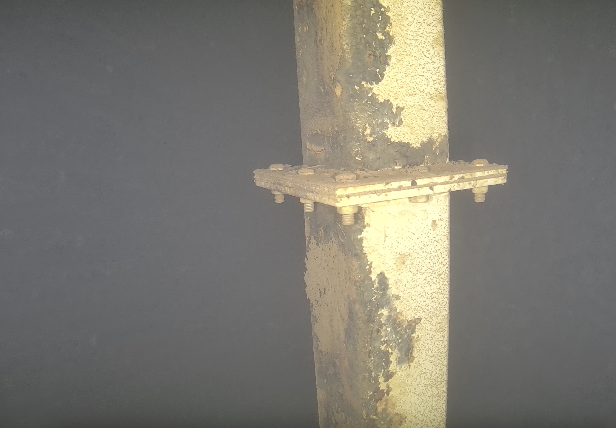 Localized coating deterioration documented on internal structural components.